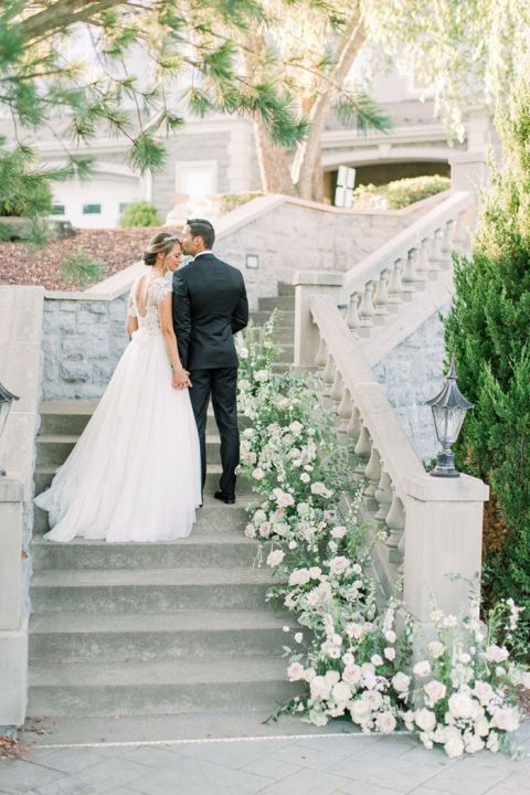 Ceremony Flowers transformed into a Staircase Decoration for this European Chateau Style Wedding