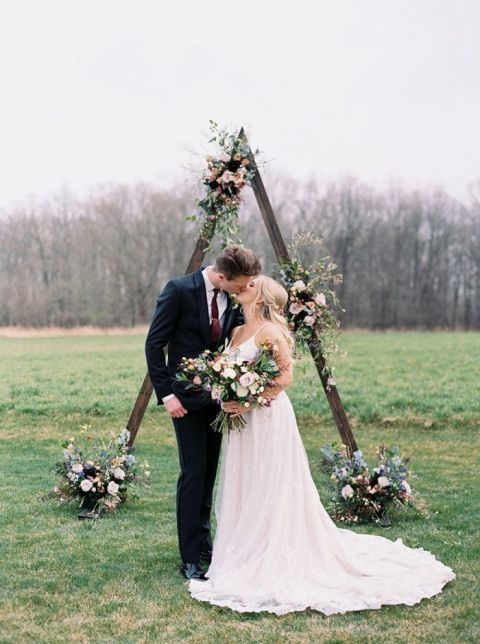 Outdoor Michigan Wedding Ceremony with a Triangle Arch and Moody Meadow