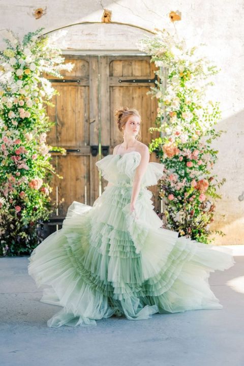 Green Ruffled Wedding Dress with a Floral Framed Door Ceremony