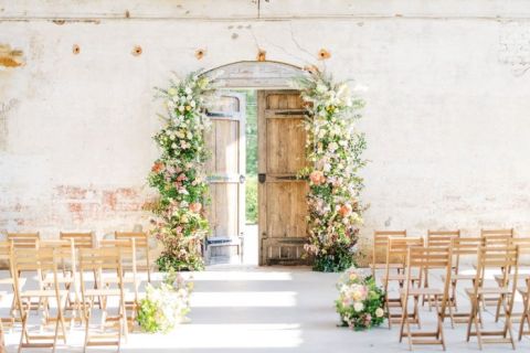 Vintage Door Ceremony Backdrop with Flower Pillars