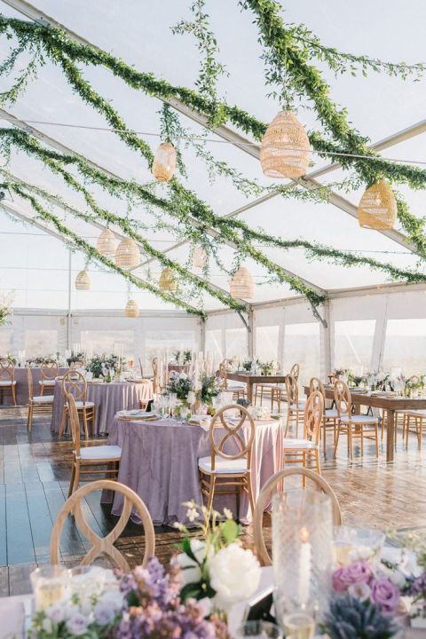 Clear Tented Wedding Reception in Nantucket with Woven Basket Lanterns and Hanging Greenery